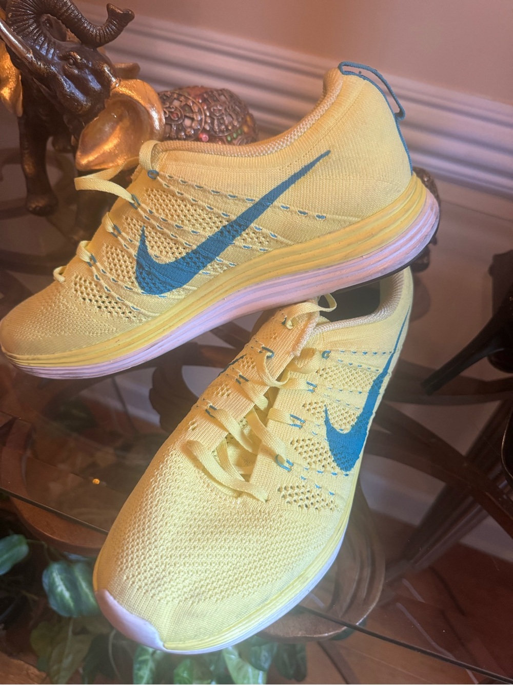 Nike Yellow Flyknit Trainers with Blue Swoosh Accents